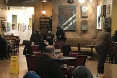 Harmony-Cafe-Fundraiser-Zach-and-Anna-talking-scaled