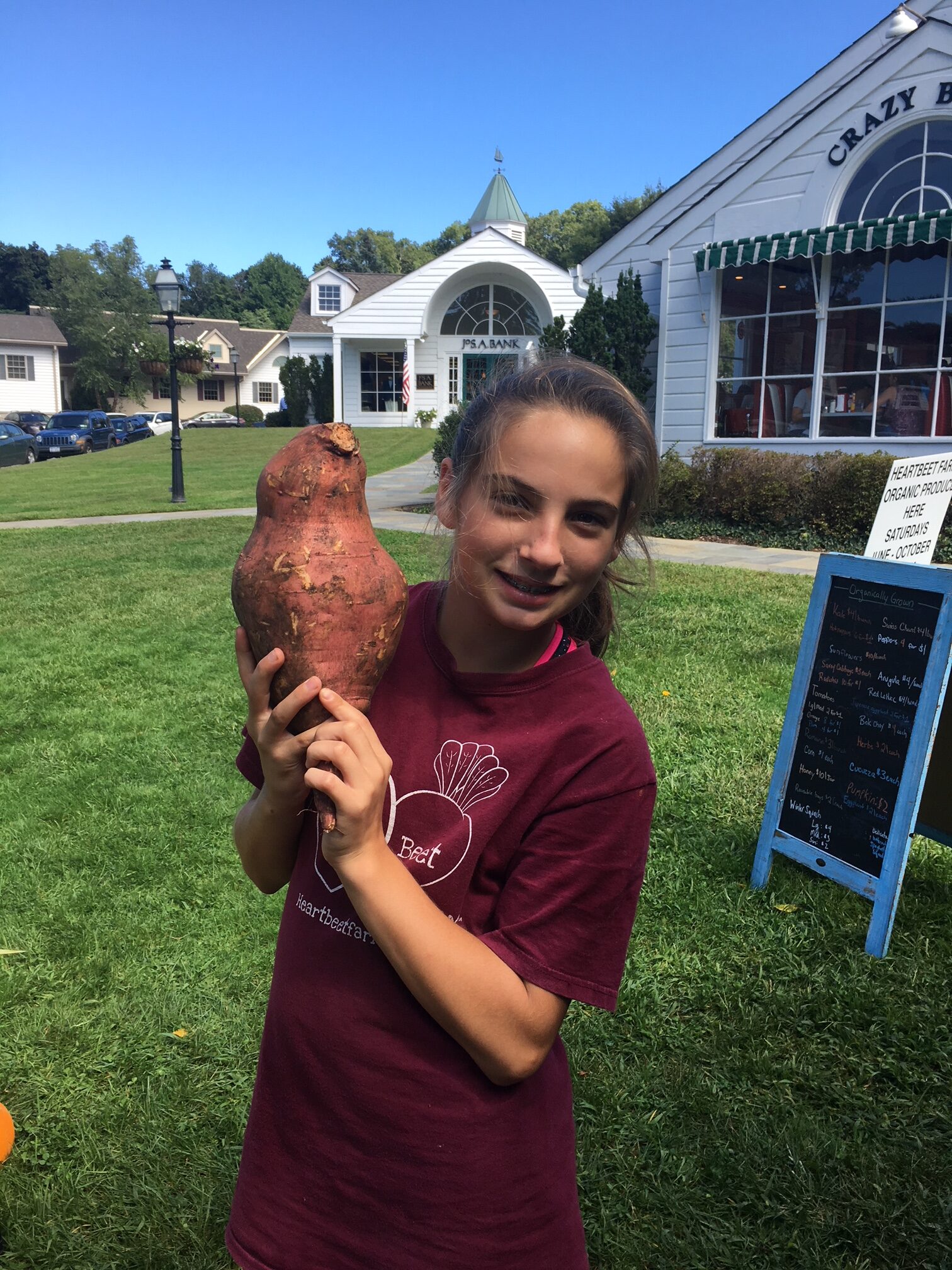 Abby holding big sweet potato 2018 2